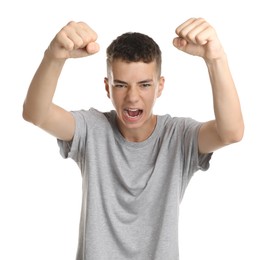 Photo of Portrait of angry teenage boy on white background