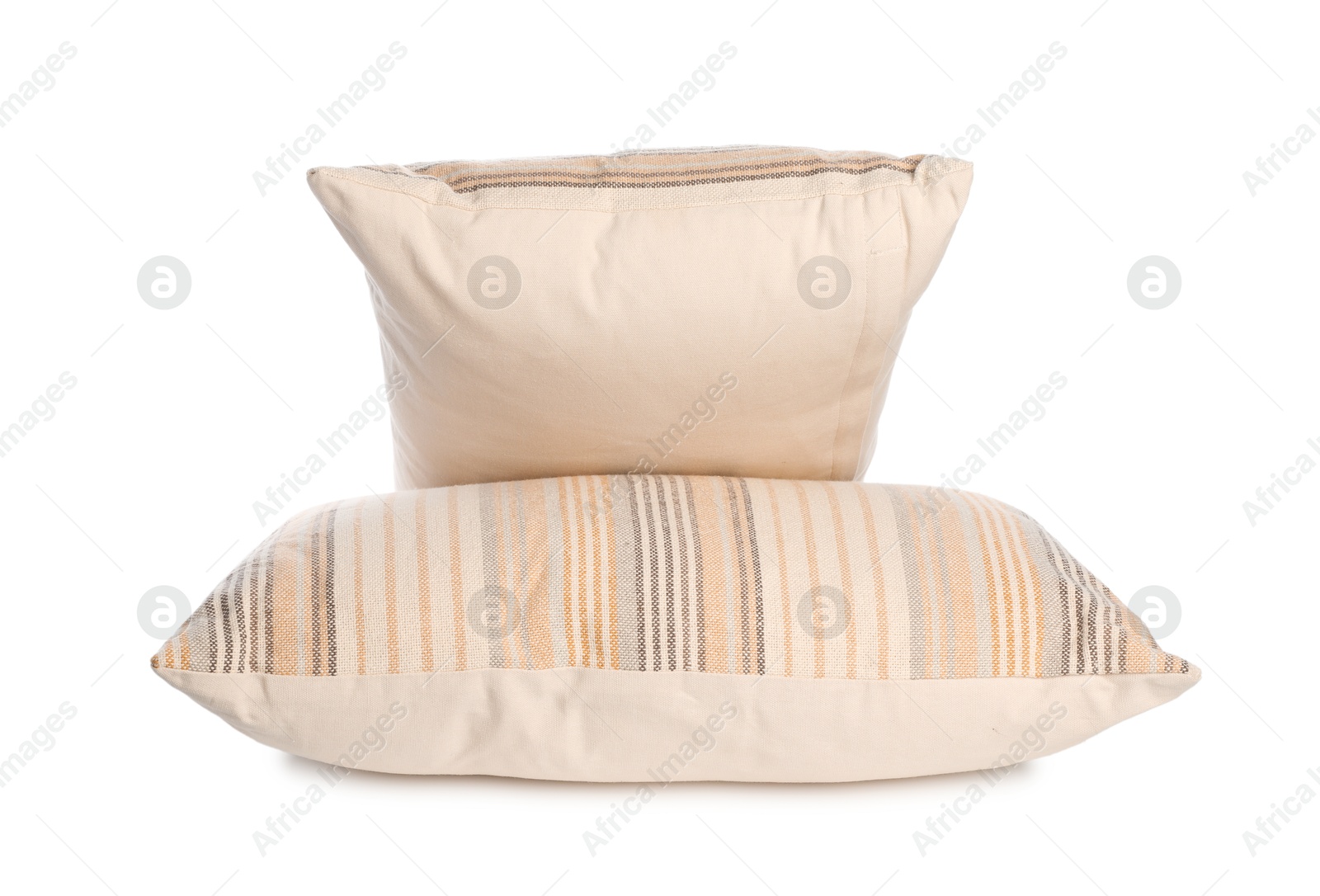 Photo of Two light striped pillows isolated on white