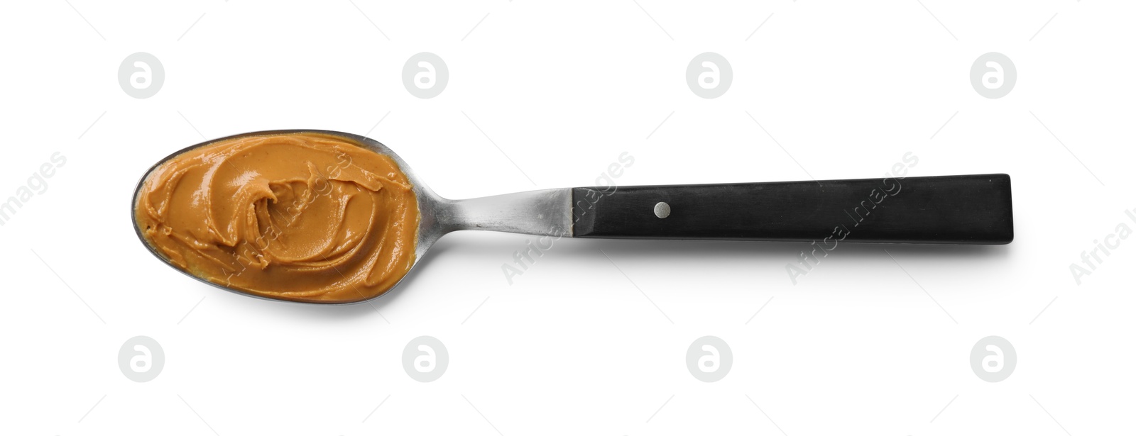 Photo of Tasty peanut butter in spoon isolated on white, top view