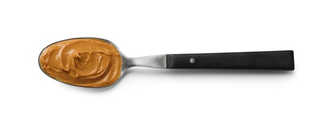 Photo of Tasty peanut butter in spoon isolated on white, top view