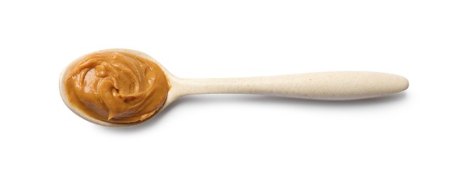 Photo of Tasty peanut butter in spoon isolated on white, top view