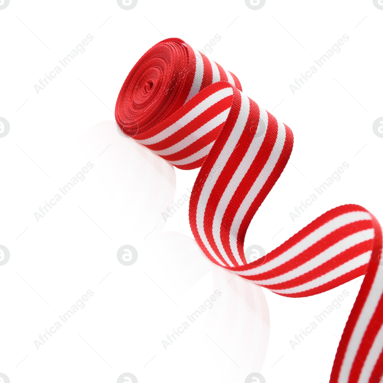 Photo of Roll of striped ribbon isolated on white