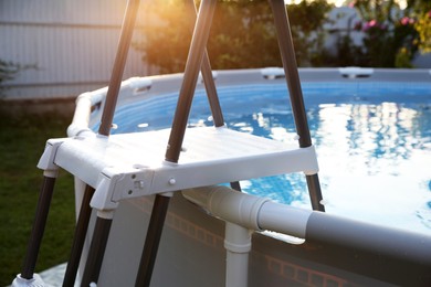 Photo of Above ground swimming pool outdoors on sunny day