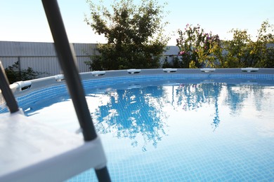 Photo of Above ground swimming pool outdoors on sunny day, closeup