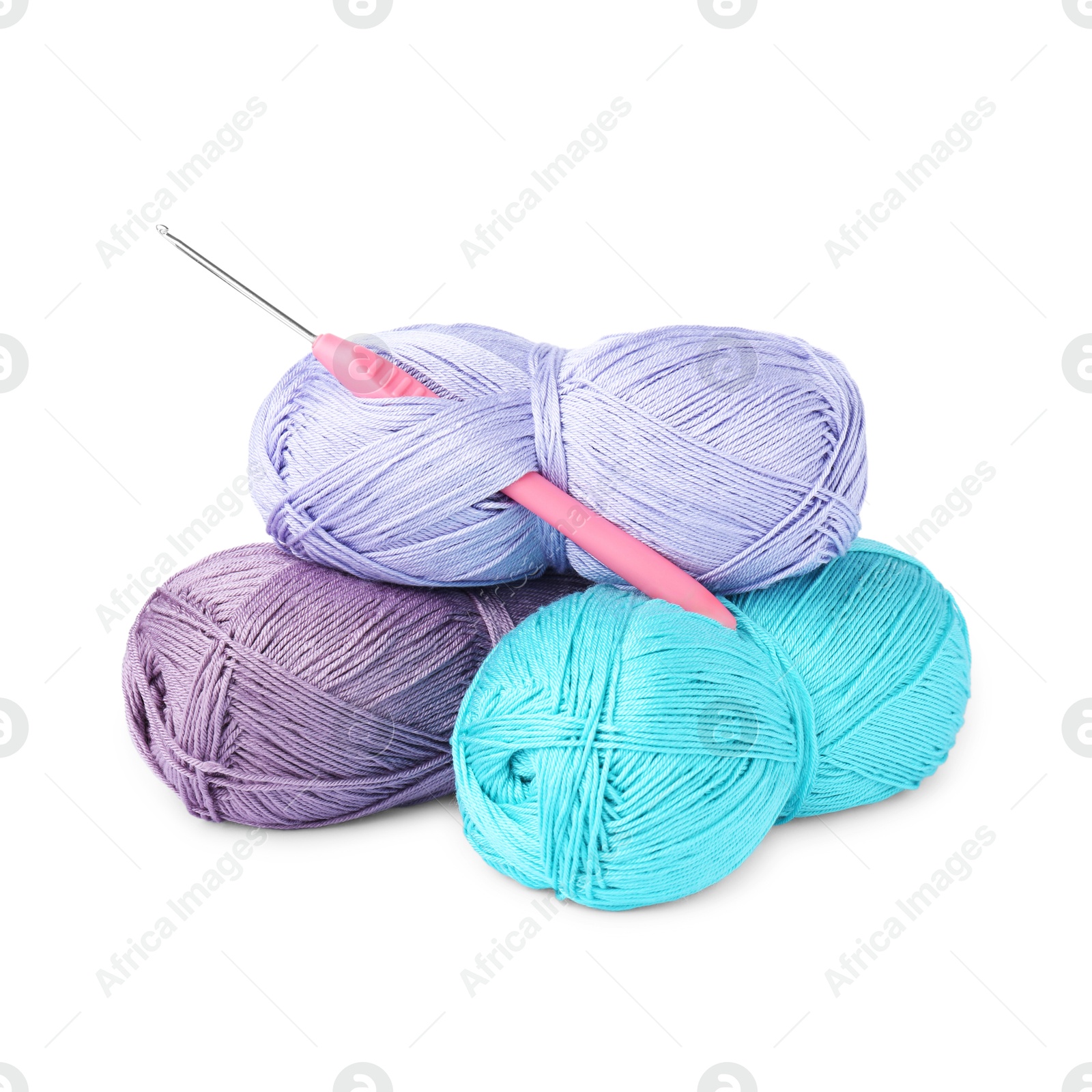 Photo of Skeins of colorful yarns and crochet hook isolated on white