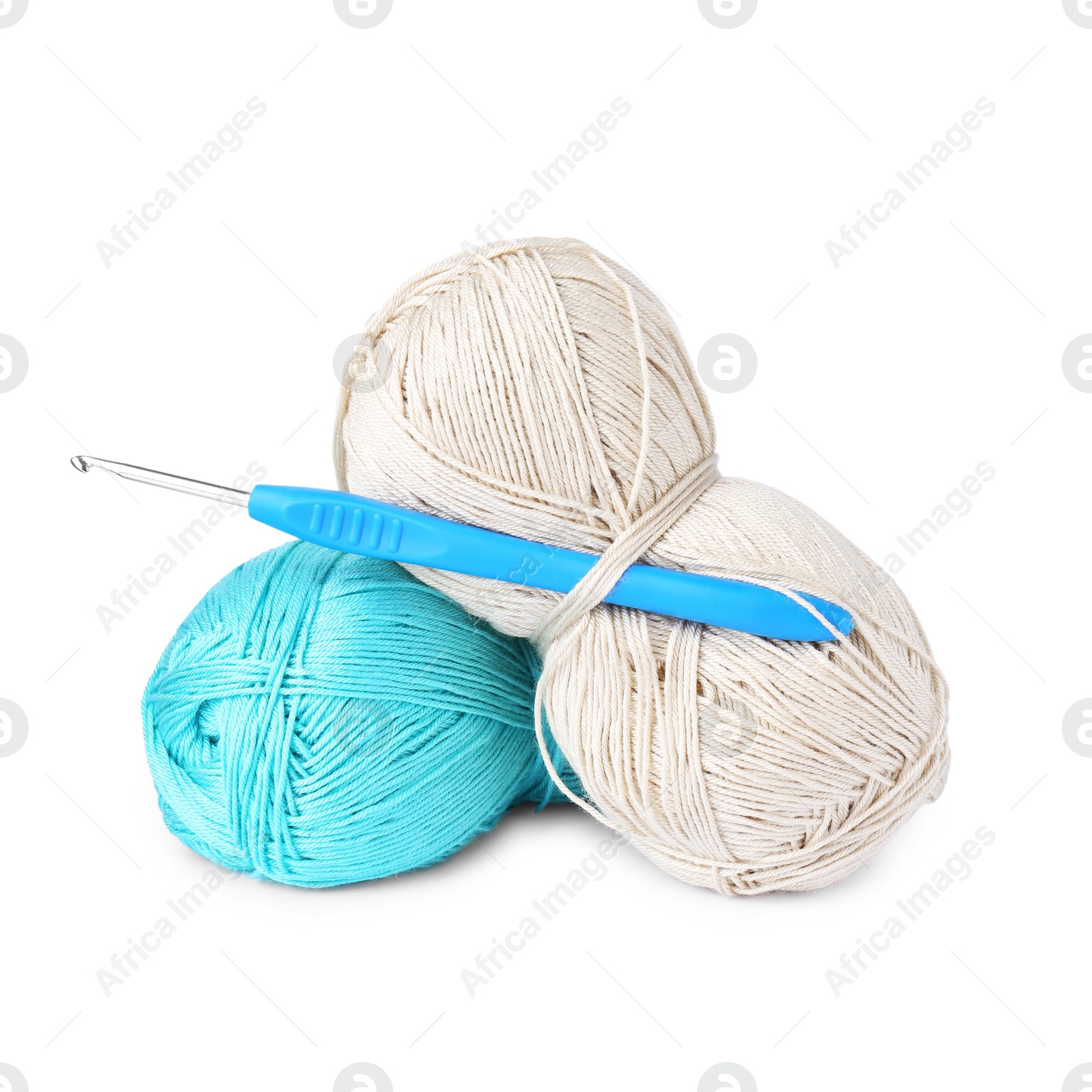 Photo of Skeins of colorful yarns and crochet hook isolated on white