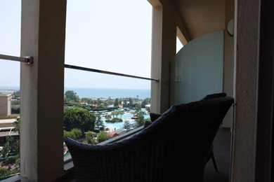 Photo of Rattan chairs on hotel balcony in luxury resort