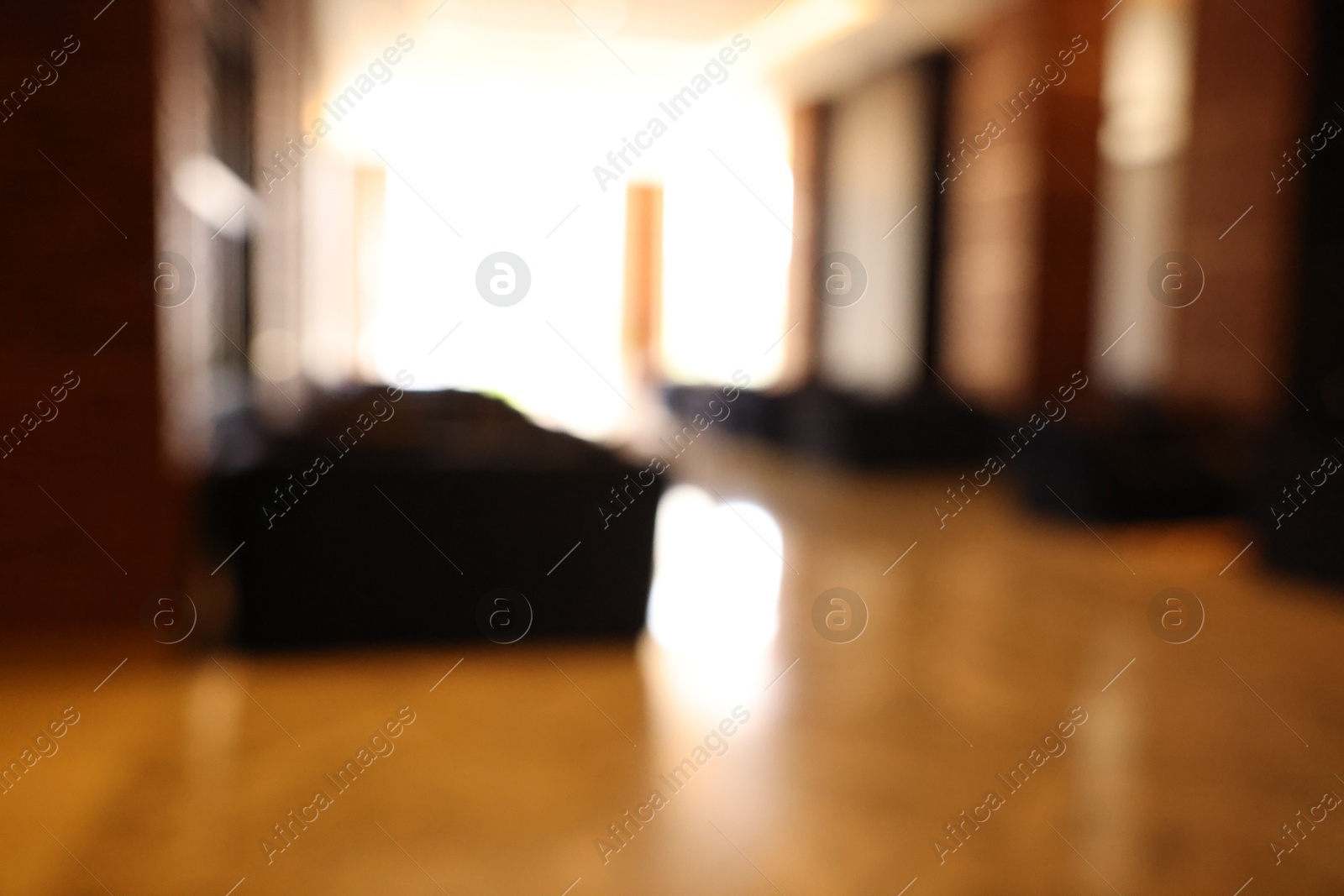 Photo of Blurred view of modern hotel lobby with comfortable furniture