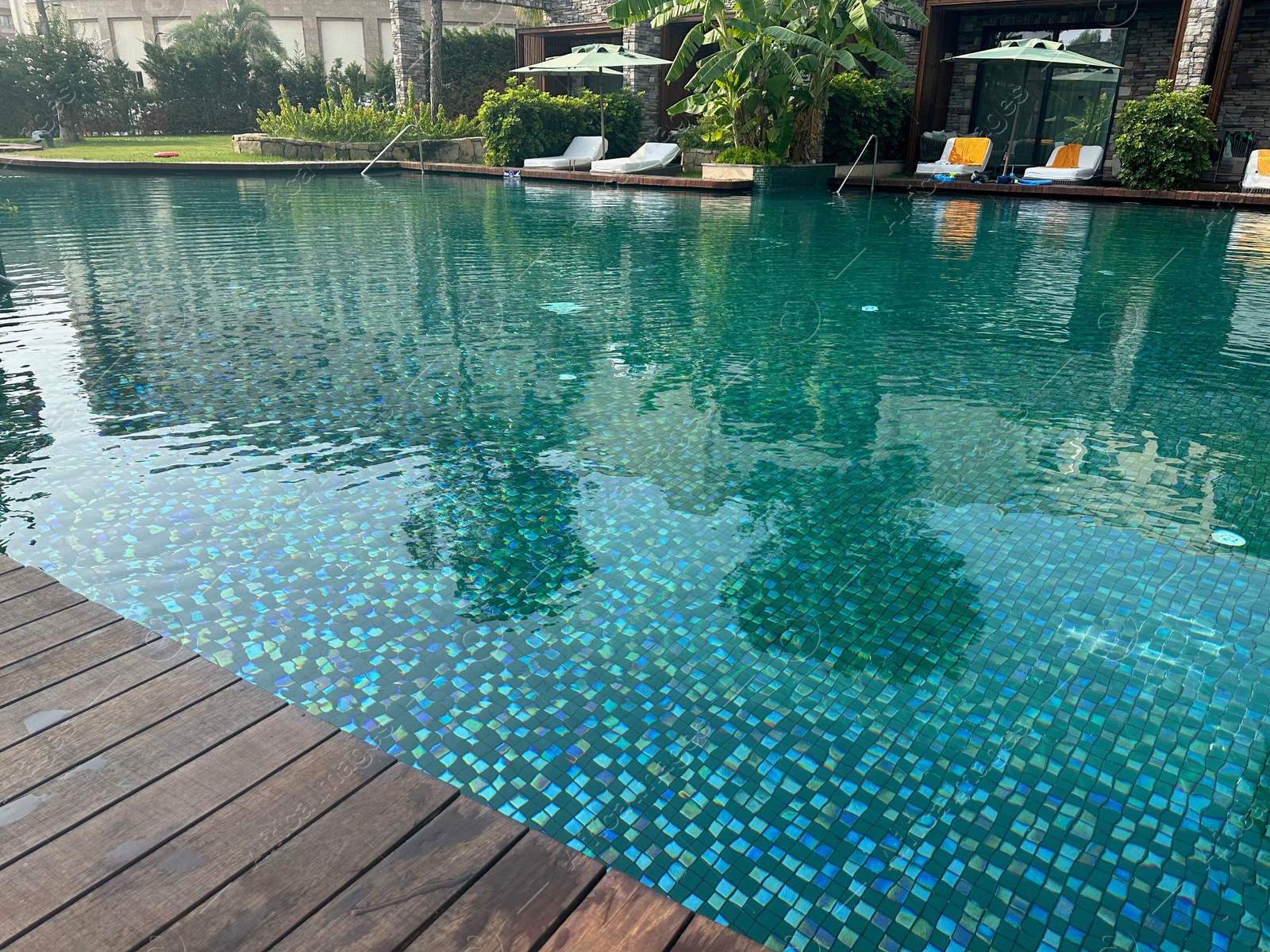 Photo of Outdoor swimming pool with clear water at luxury resort