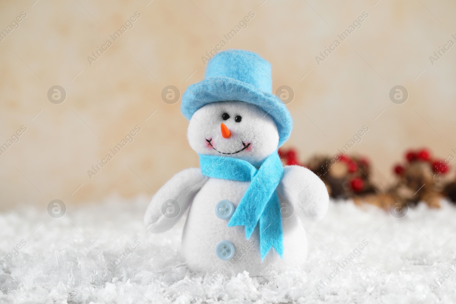 Photo of Funny decorative snowman figure on artificial snow