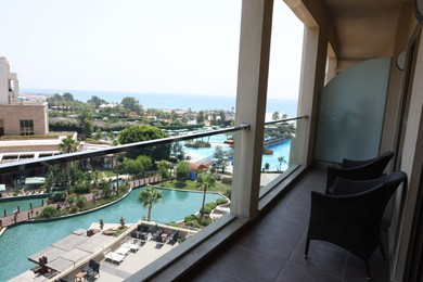 Belek, Turkey - July 25, 2024: Rattan chairs on hotel balcony in luxury resort