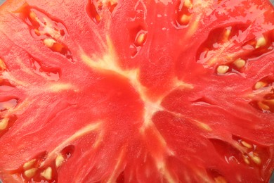 Photo of Cut ripe red tomato as background, top view