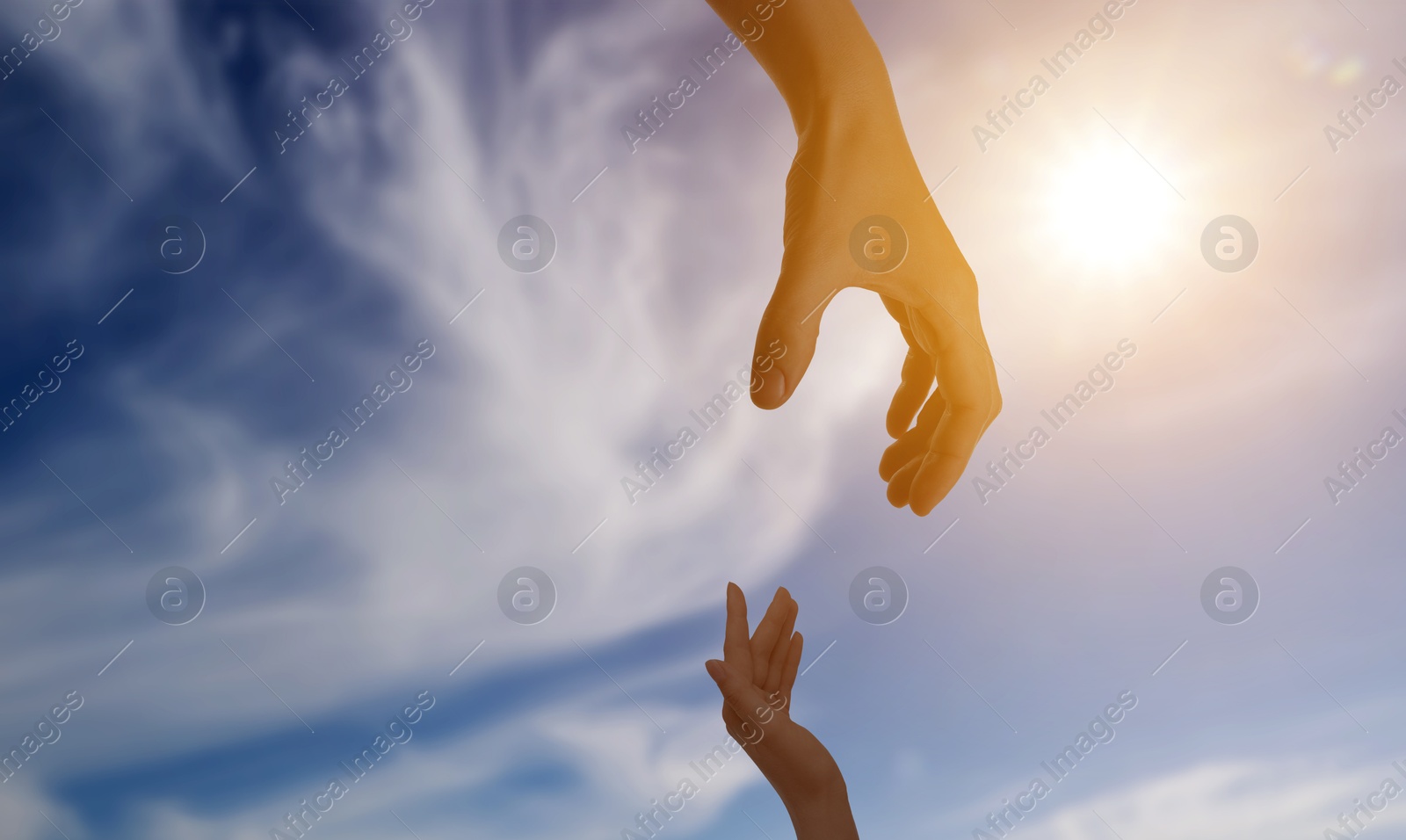 Image of God's help and support. Human reaching for hand from heaven