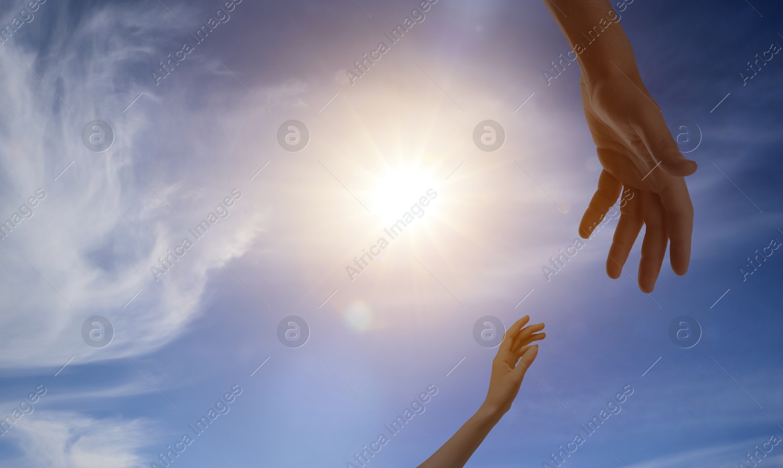 Image of God's help and support. Human reaching for hand from heaven