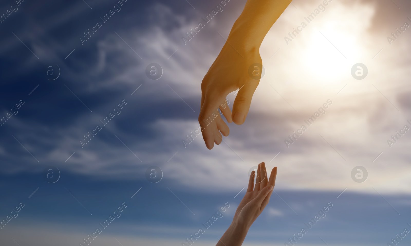 Image of God's help and support. Human reaching for hand from heaven