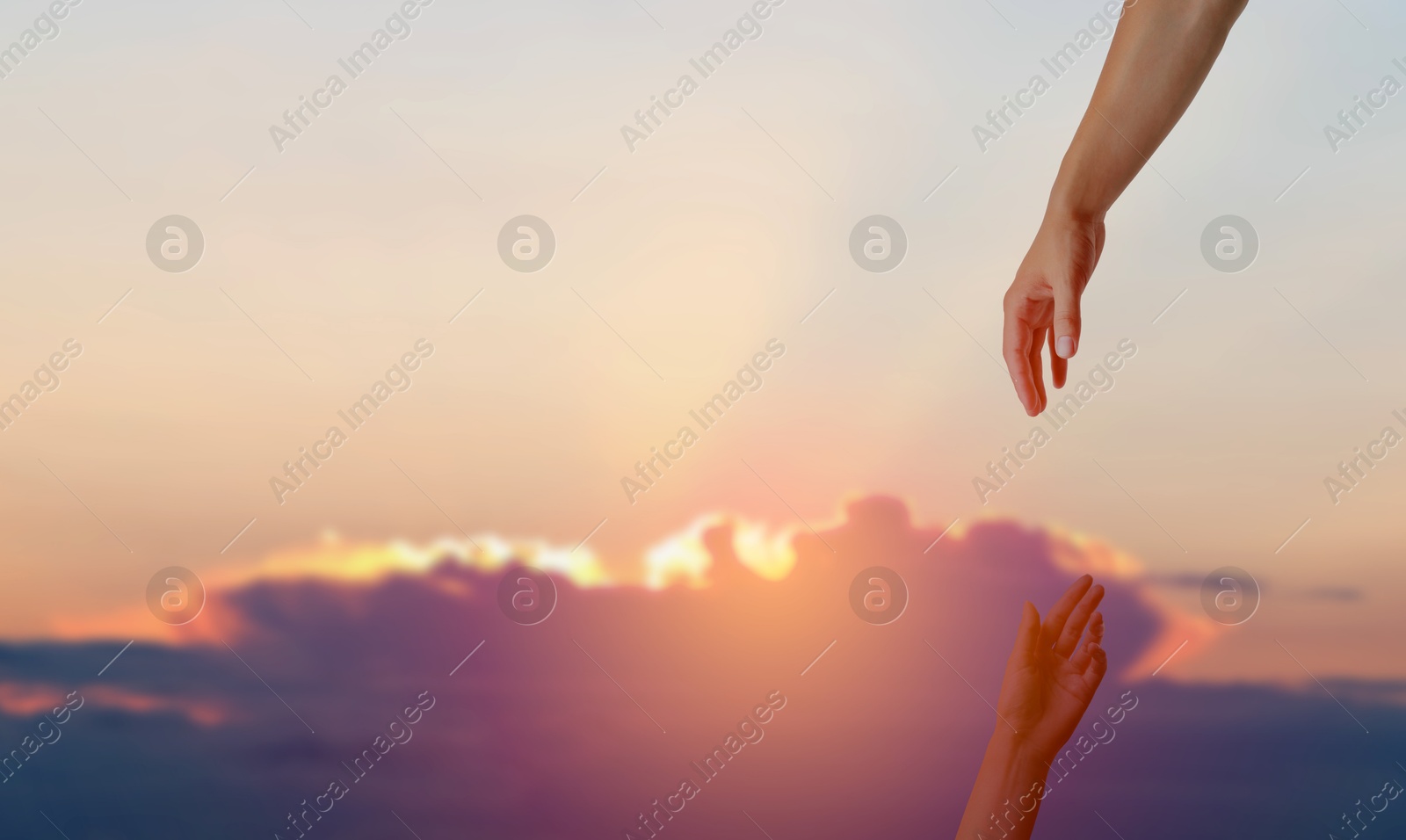 Image of God's help and support. Human reaching for hand from heaven