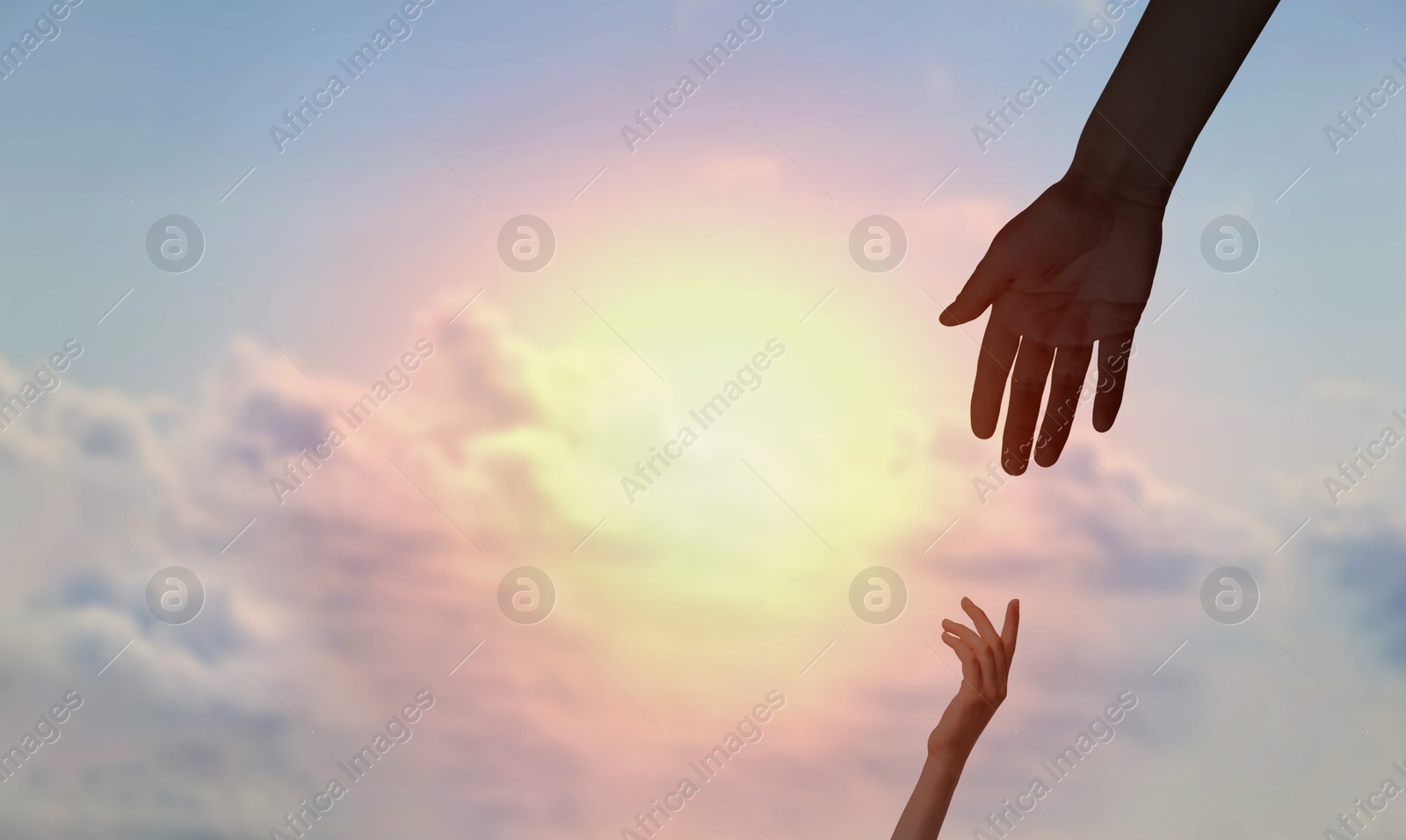 Image of God's help and support. Human reaching for hand from heaven