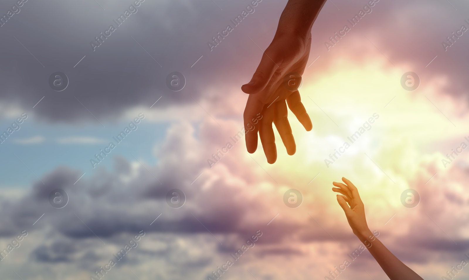 Image of God's help and support. Human reaching for hand from heaven