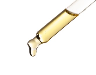 Photo of Essential oil dripping from pipette against white background