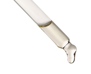 Photo of Essential oil dripping from pipette against white background