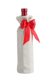 Photo of Wine bottle in burlap package with red ribbon isolated on white