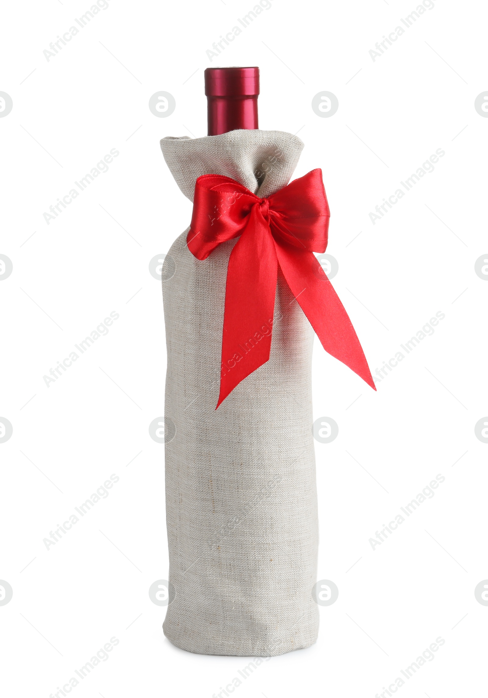 Photo of Wine bottle in burlap package with red ribbon isolated on white