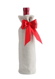 Photo of Wine bottle in burlap package with red ribbon isolated on white