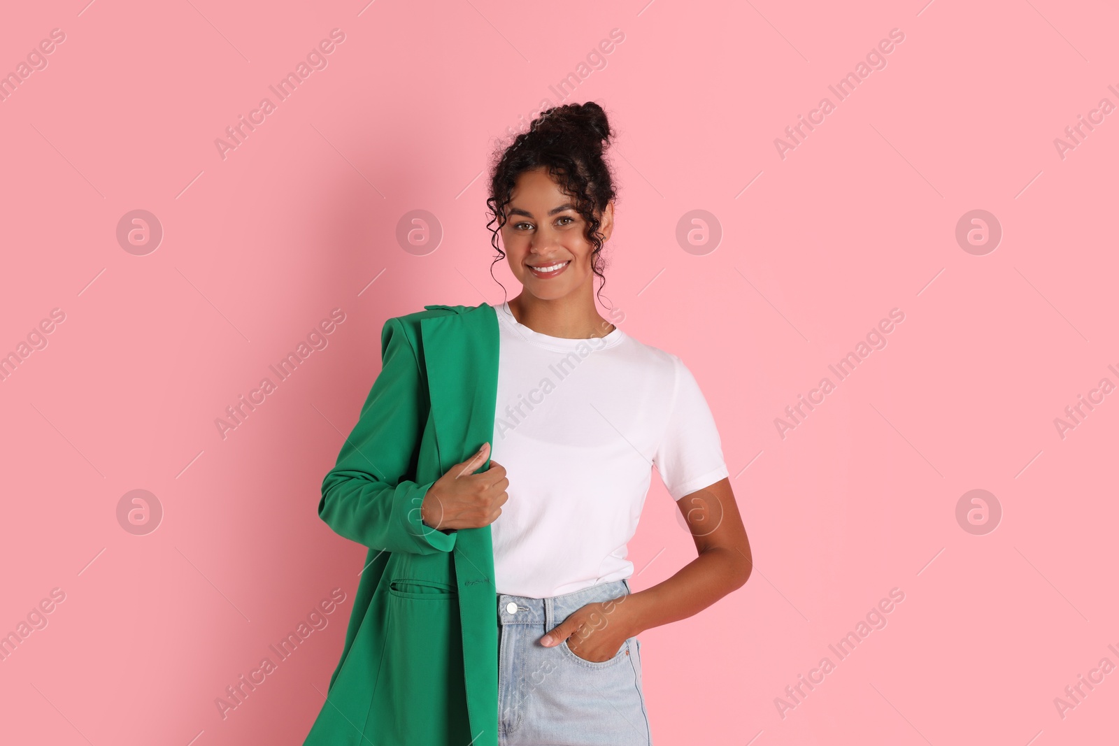 Photo of Beautiful woman with stylish jacket on pink background