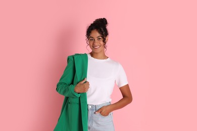 Photo of Beautiful woman with stylish jacket on pink background