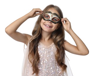 Photo of Cute girl wearing carnival mask and blowing kiss on white background