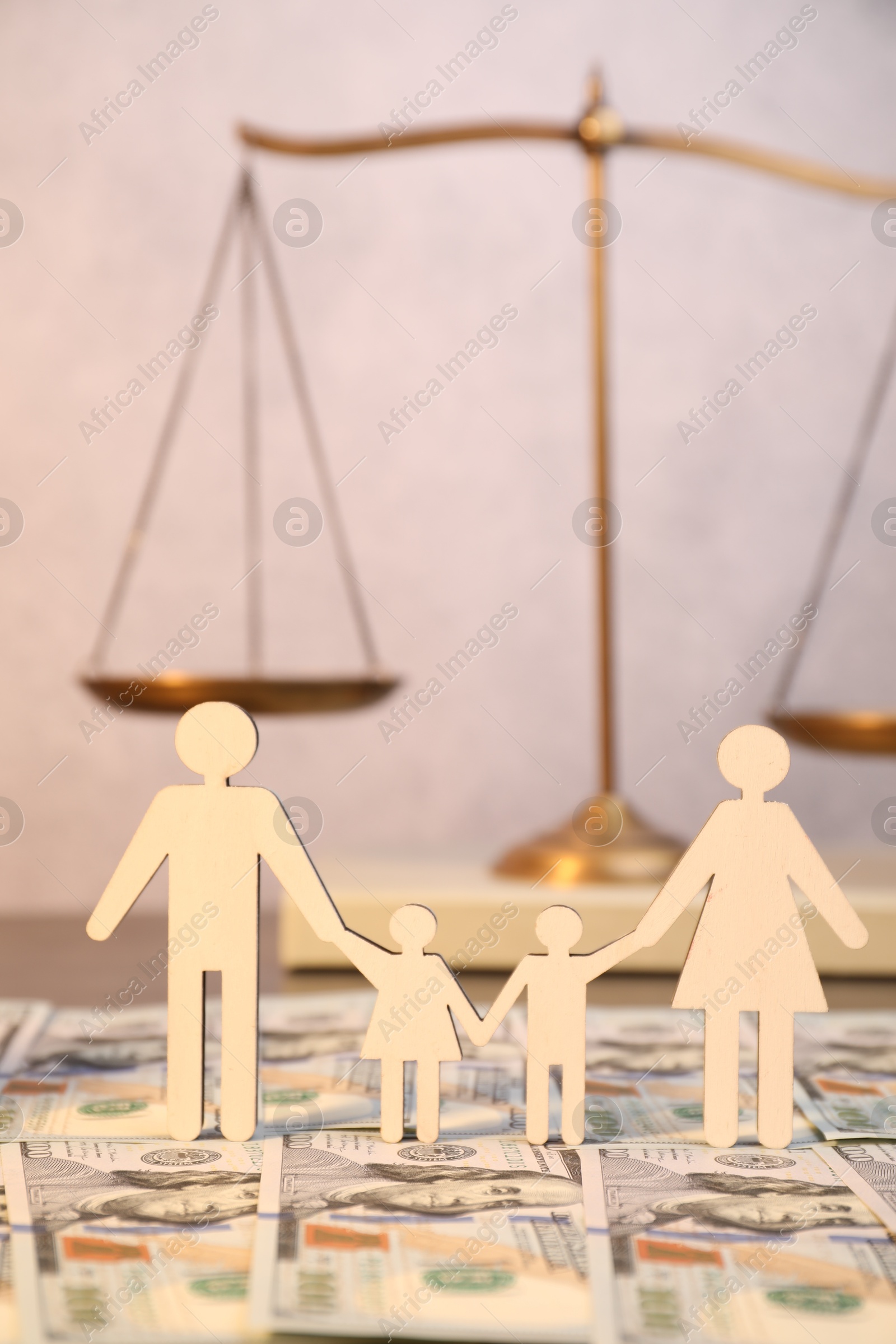 Photo of Alimony. Figures of family and dollar banknotes on table, closeup