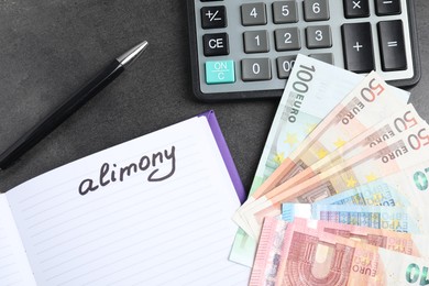 Photo of Notebook with word Alimony, euro banknotes, calculator and pen on grey table, flat lay