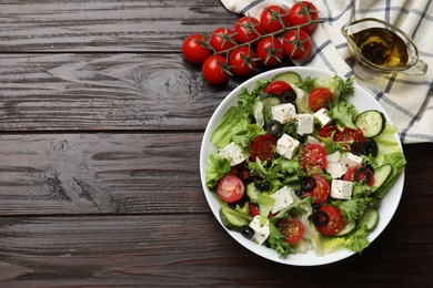 Photo of Delicious salad with feta cheese on wooden table, flat lay. Space for text