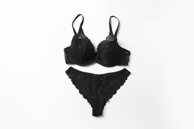 Photo of Elegant black lace women's underwear on white background, top view