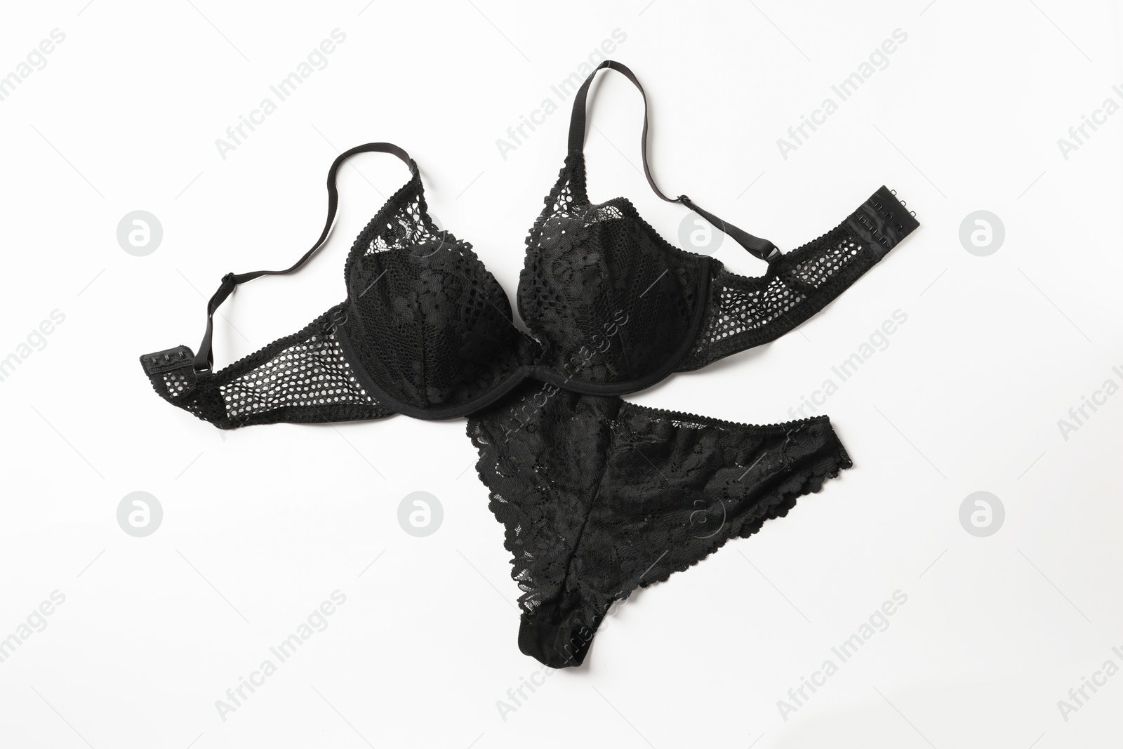 Photo of Elegant black lace women's underwear on white background, top view