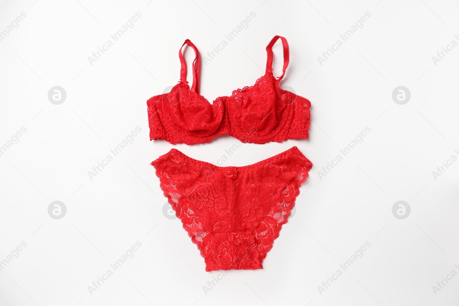 Photo of Elegant red lace women's underwear on white background, top view