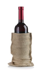 Photo of Wine bottle in burlap bag isolated on white