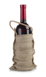 Photo of Wine bottle in burlap bag isolated on white