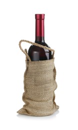 Photo of Wine bottle in burlap bag isolated on white