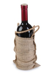 Photo of Wine bottle in burlap bag isolated on white