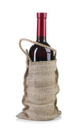 Photo of Wine bottle in burlap bag isolated on white