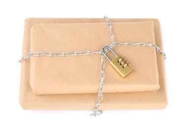 Photo of Parcels with chain and padlock isolated on white, top view