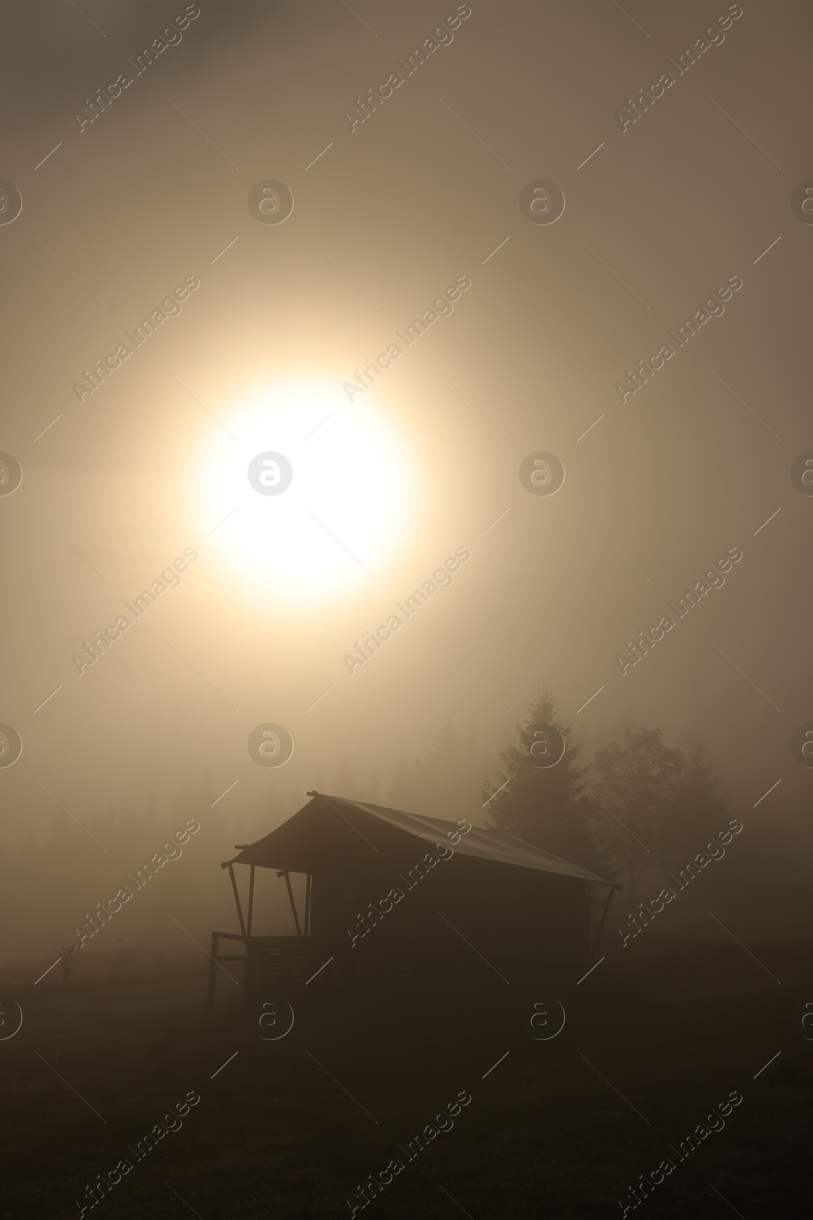 Photo of Beautiful cloudless morning sky and house in mountains at sunrise