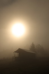 Photo of Beautiful cloudless morning sky and house in mountains at sunrise