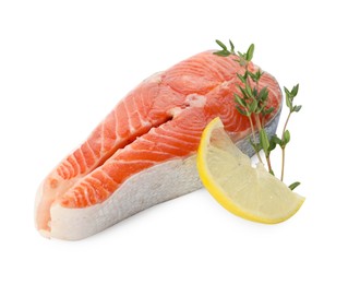 Photo of Fresh salmon steak, lemon and thyme isolated on white