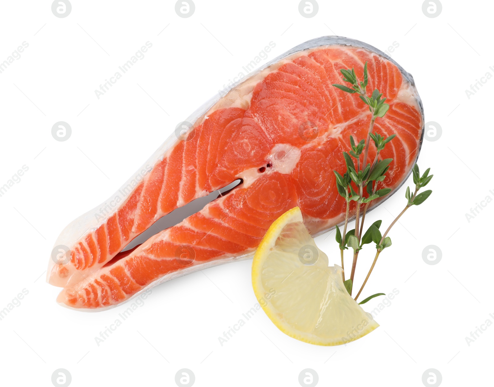 Photo of Fresh salmon steak, lemon and thyme isolated on white, top view