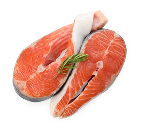 Photo of Two fresh salmon steaks and rosemary isolated on white, top view