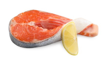 Photo of Fresh salmon steak and piece of lemon isolated on white