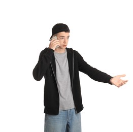 Portrait of teenage boy with phone on white background