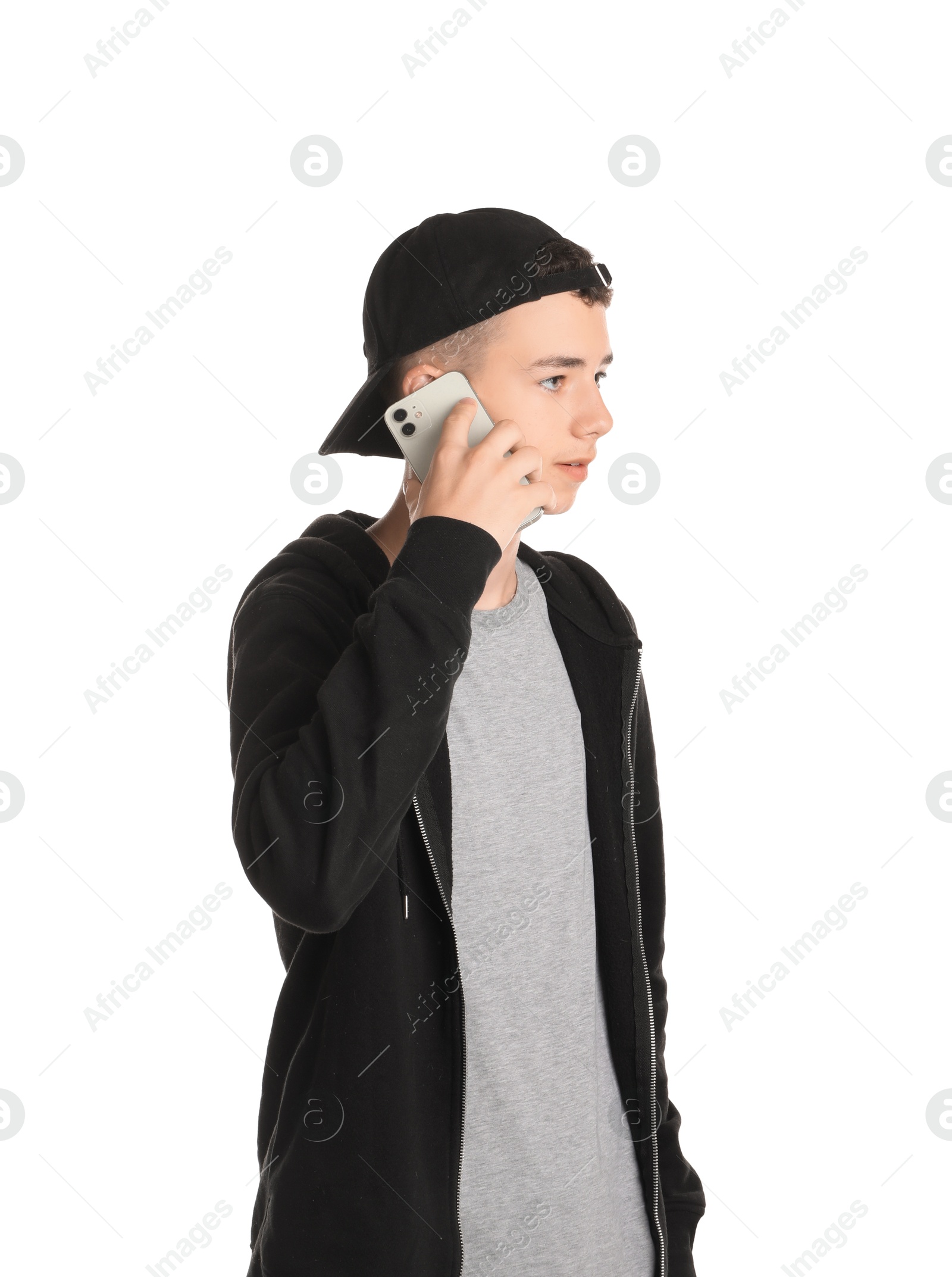 Photo of Portrait of teenage boy with phone on white background